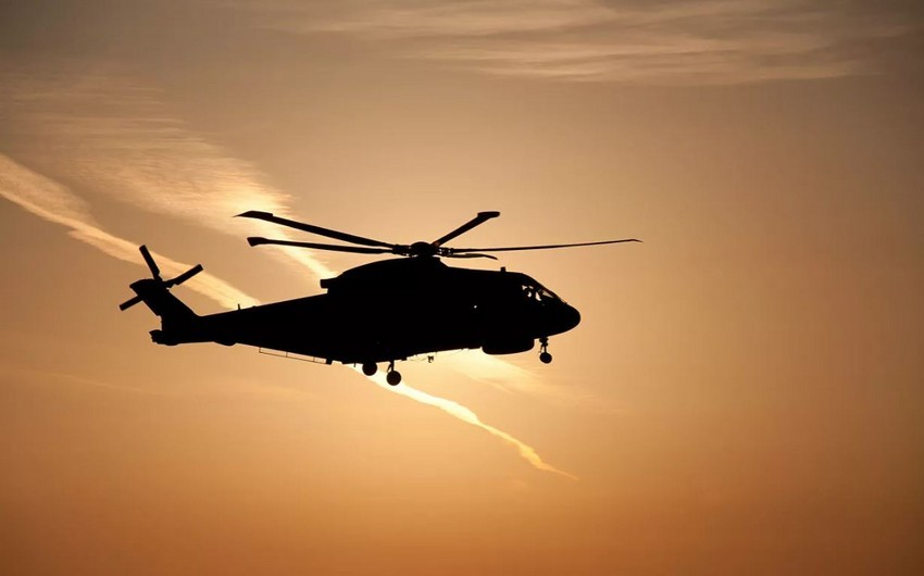 DÜNYA ŞOKDA: Taliban bir nəfəri helikopterdən asdı - VİDEO