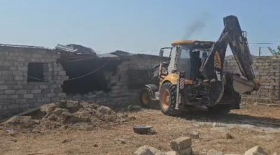 Bakıda qanunsuz tikili söküldü - VİDEO