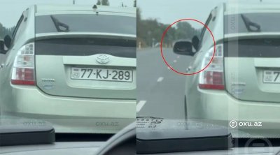 Ayağını yolboyu pəncərədən çıxaran sürücü təhlükə yaratdı – VİDEO