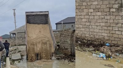 Xəzər rayonunda küçəni çirkab su basdı - VİDEO